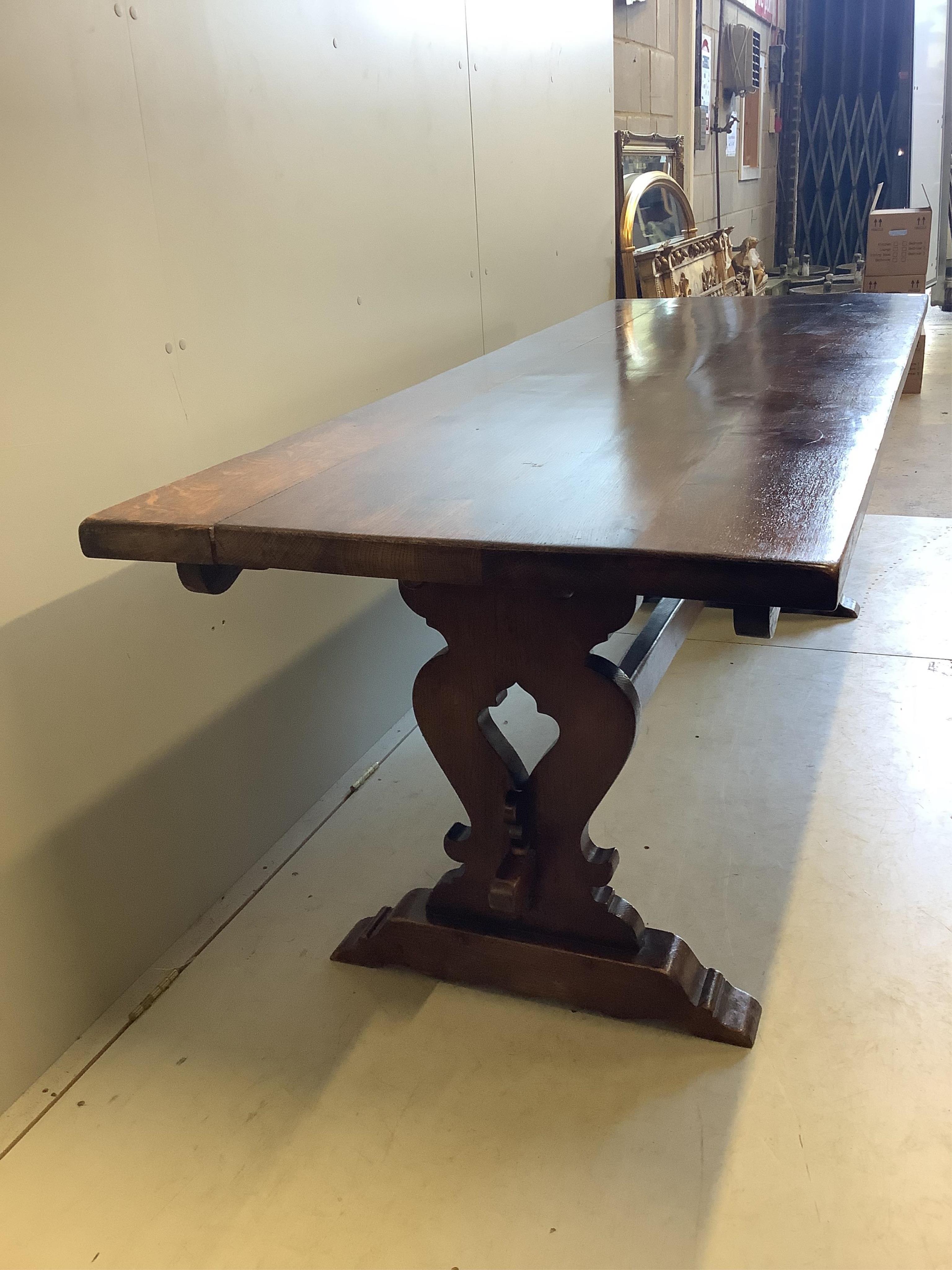 An 18th century style rectangular oak refectory dining table, width 222cm, depth 83cm, height 76cm. Condition - fair